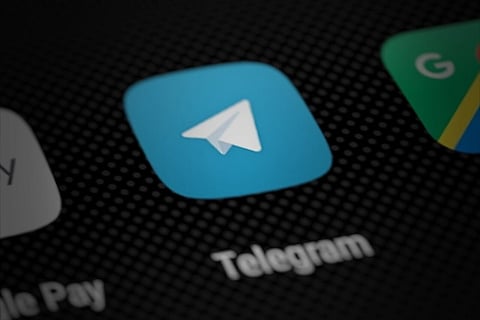 Telegram app icon on smartphone screen illustration. 