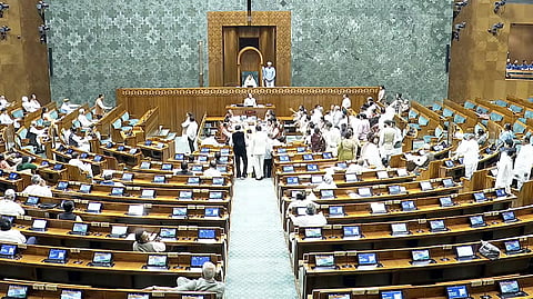 Members protest in the Well of the Lok Sabha