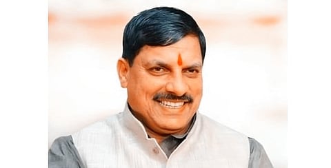 In the image a man is shown smiling at the camera 