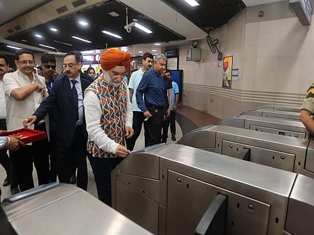 Delhi L-G Sandhu travels in Metro, poses for selfies with youth