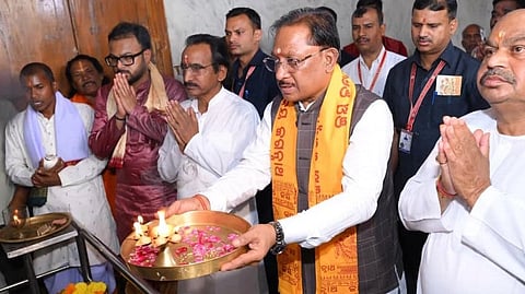 Vishnu Deo Sai offering arti at the Shri Jagannath Temple in Gayatri Nagar, Raipur, surrounded by people