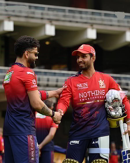 Virat Kohli asks Royal Challengers Bengaluru (RCB) teammates about challenges ahead as they defend their title in the Indian Premier League (IPL) 2026, which starts at the M. Chinnaswamy Stadium in Bengaluru on March 28. Photo credit: @rcbtweets/X