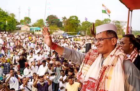 Barpeta: Assam Congress President Gaurav Gogoi waves to the gathering during a public meeting in support of Congress candidate Abdur Rahim Ahmed for the Assam Assembly elections, at Bamundongra in Chenga constituency of Barpeta district on Wednesday, March 25, 2026. (Photo: IANS/X/@INCAssam)