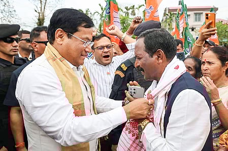 Dibrugarh: Union Minister Sarbananda Sonowal with BJP candidate from Makum constituency Sanjoy Kishan before the latter files his nomination for the Assam Assembly elections in Dibrugarh on Monday, March 23, 2026. (Photo: IANS/X/@sarbanandsonwal)