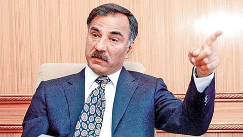 In the image IAS Pradeep Sharma is shown pointing on the side