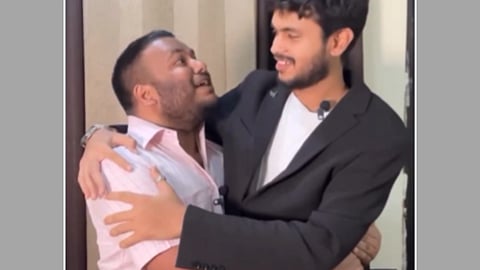 In the image Pulkit Mani mimicking PM Modi is shown hugging another person mimicking foreign dignitaries