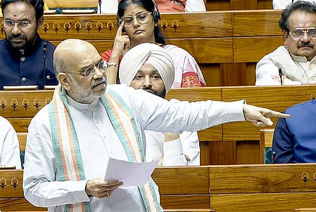 New Delhi: Union Home Minister Amit Shah speaks in the Lok Sabha during the second part of the Budget Session of Parliament in New Delhi on Monday, March 30, 2026. (Photo: IANS/Sansad TV)
