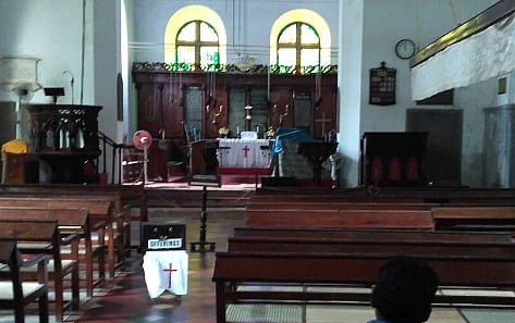 Inside of a church in a dimly lit atmosphere. The image is of St. Franch Church, Kochi.