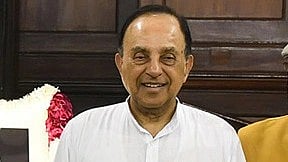 In the image Subramanian swamy is shown smiling at the camera he is wearing a white kurta