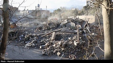 Buildings in Tehran completely destroyed in bombing the image is of Press conference at the site of the bombing of the University of Science and Technology