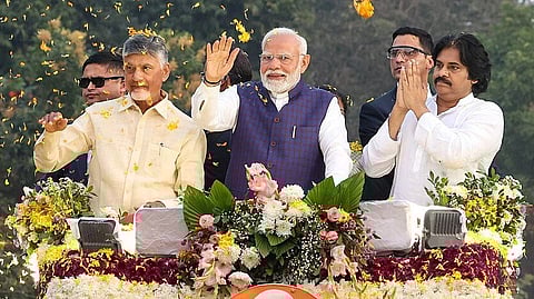 PM Modi in a roadshow with CM Nara Chandrababu Naidu & DCM Pawan Kalyan with flower petals flying
