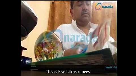 screengrab from Narada sting operation showing Suvendu Adhikari accepting ₹5 lakh cash.