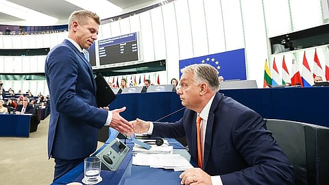 In the image two leaders are shown shaking hands 