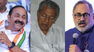 Image of VD Satheesan talking, Pinarayi Vijayan (center) writing- he is looking down, rajeev Chandrasekhar (far right) holding a mic and speaking 