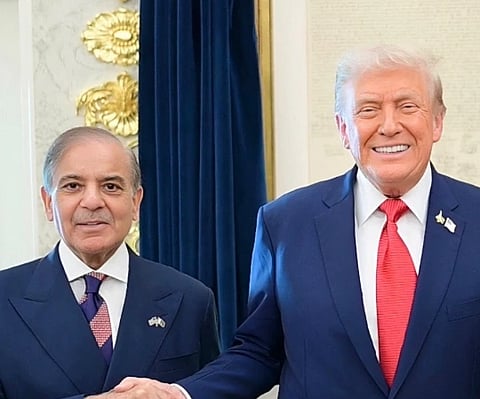 Image of Pakistan's Field Marshal Syed Asim Munir (left) and President Donald trump standing next to each other and shaking hands. 