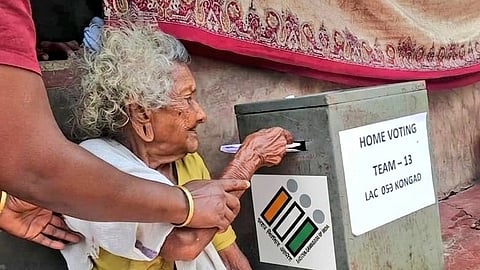 Election officials managing voting process at polling station in India