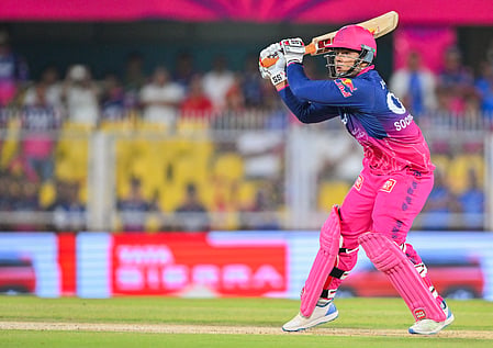 In the image Vaibhav Sooryavanshi is shown in the cricket stadium fighting the match for Rajasthan Royals