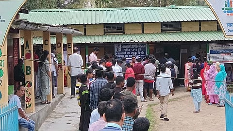 A long queue of voters outside a polling booth in Digboi, Assam