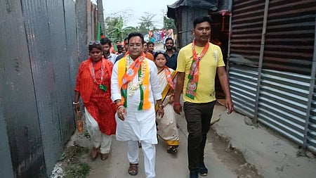 In the image leaders are shown walking wearing BJP merchandise
