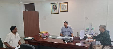 In the image three officers are shown in a office