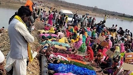 women lying on pyres, while a group sits next to them and men stand watching