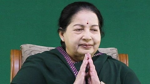 In the image Jayalalithaa is shown joining hands 
