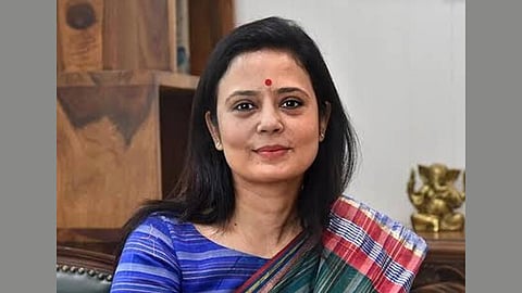 In the image TMC MP Mahua Moitra is shown smiling while posing to the camera