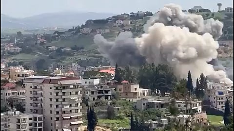 An explosion inbetween building and hills in Nabatieh in South Lebanon