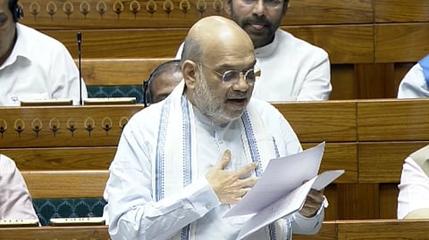 Amit Shah speaking in Lok Sabha with papers in hand
