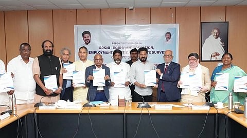 Many people pose with the SEEEPC Survey 2024 in front of a banner with the same