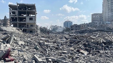 Rubble and ruins as a few dmaged building stand in the background