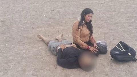 chilling visual from the pahalgam terror attack 2025, where the wife of the vicitim is seen sitting beside him 