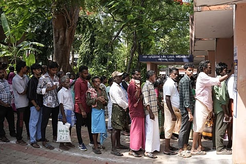 men voters standing in line during the 2026 Tamil Nadu Election