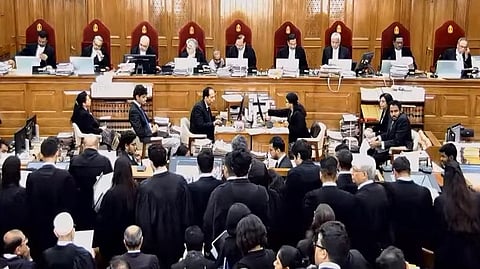 A group of lawyers standing before a 9-judge bench at the Supreme Court of India