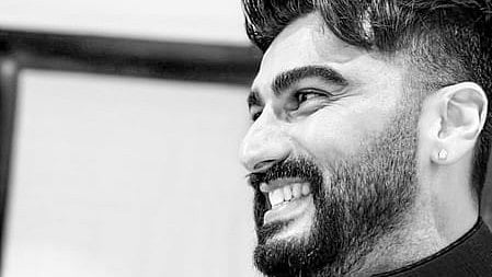 Arjun kapoor candid image where he is smiling