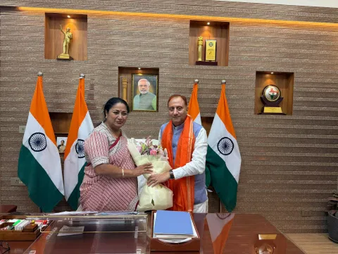 Delhi CM Rekha Gupta (left) greets newly elected MCD Mayor Pravesh Wahi (right) from BJP