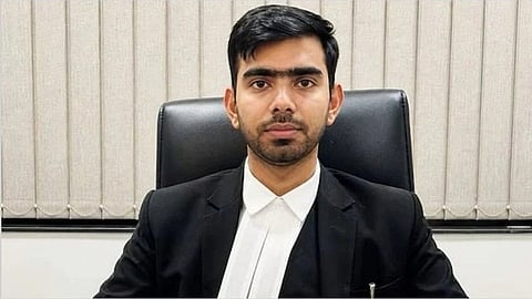 In the image Aman Kumar Sharma is shown looking at the camera 