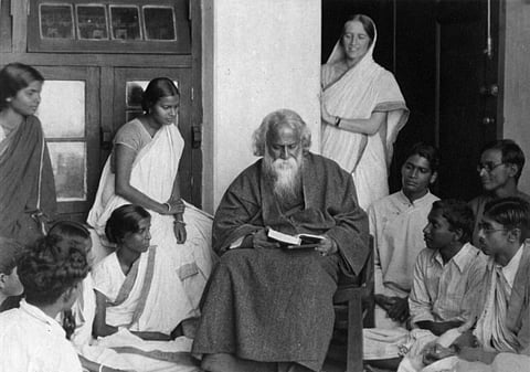 Rabindranath Tagore surrounded by young men and women