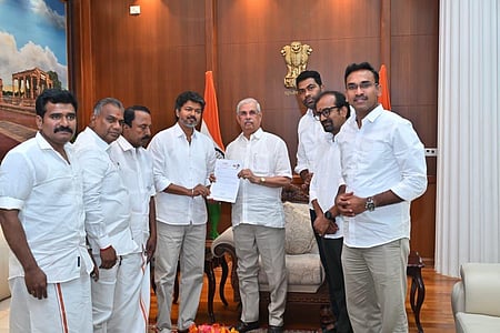 In the image TVK leader Vijay is shown with his followers in the governor office