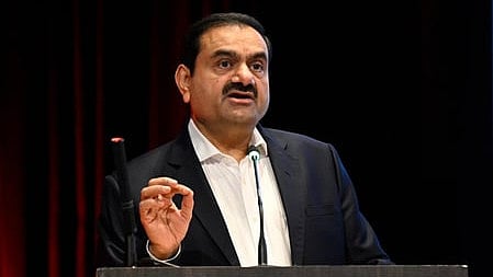 Gautam Adani in front of a podium