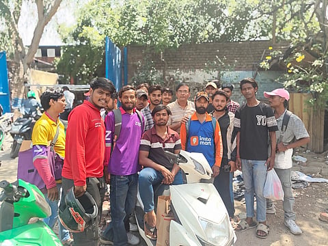 A grouop of Gig workers posing for a photo