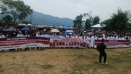 a large group standing with banners
