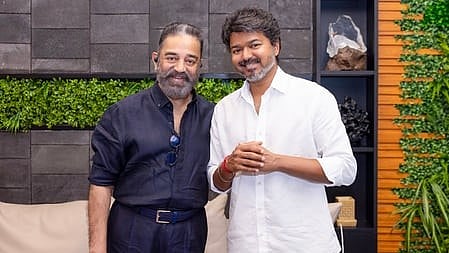 In the image Kamal Hassan is shown with Thalapathy Vijay smiling at the camera in a casual surrounding