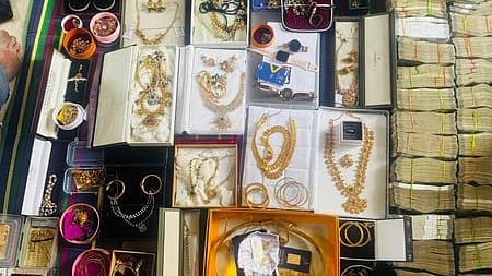In the image Gold jewellery and ash is shown