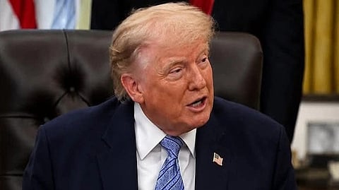 In the image Donald Trump is shown talking to someone 