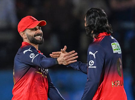 photo showing RCB Player kohli in its sports jersey 