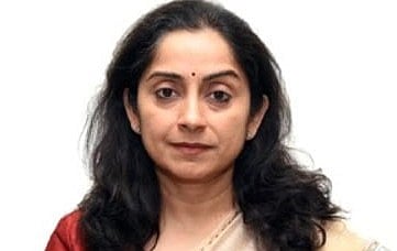 image of Dr. Shamika Ravi, Member of PM Modi's Economic Advisory Council in a cream coloured saree. 