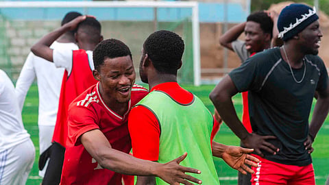 Haiti players in the football field playing.