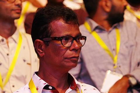 Image of Actor Indrans looking towards his left at 48th Kerala State Film Awards' ceremony