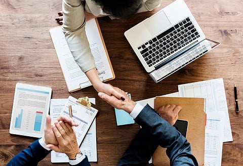 Business professionals reviewing documents during the company registration and business setup process in Dubai
